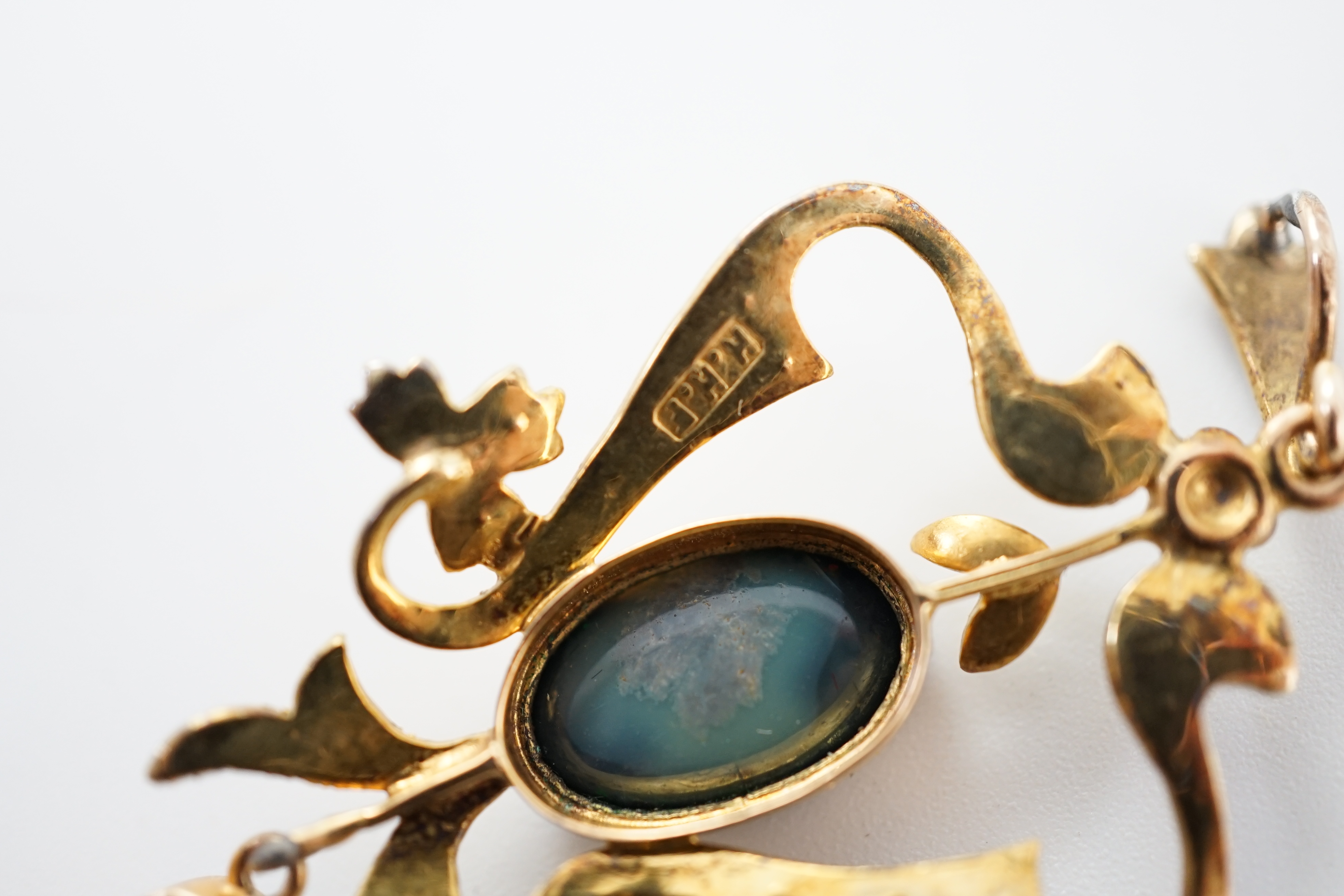 A late Victorian 15ct gold, two stone oval black opal and seed pearl cluster set drop pendant